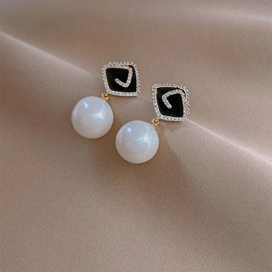 White pearl zirconia gold drop earrings