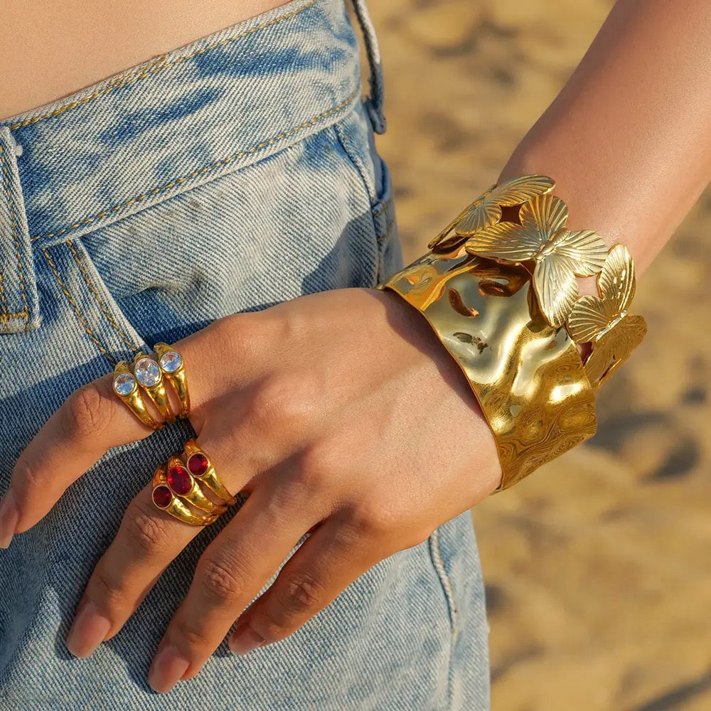 Wide wavy gold bangles