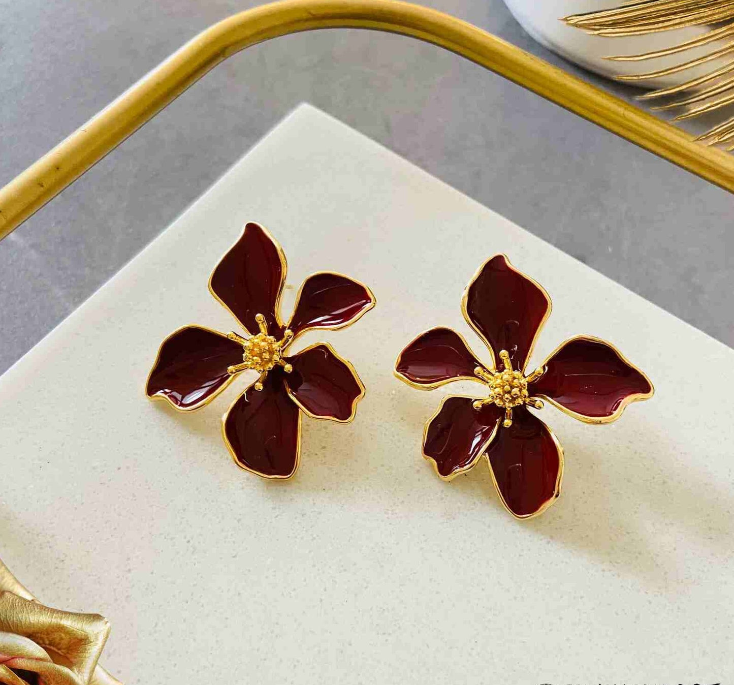 Maroon floral gold studs