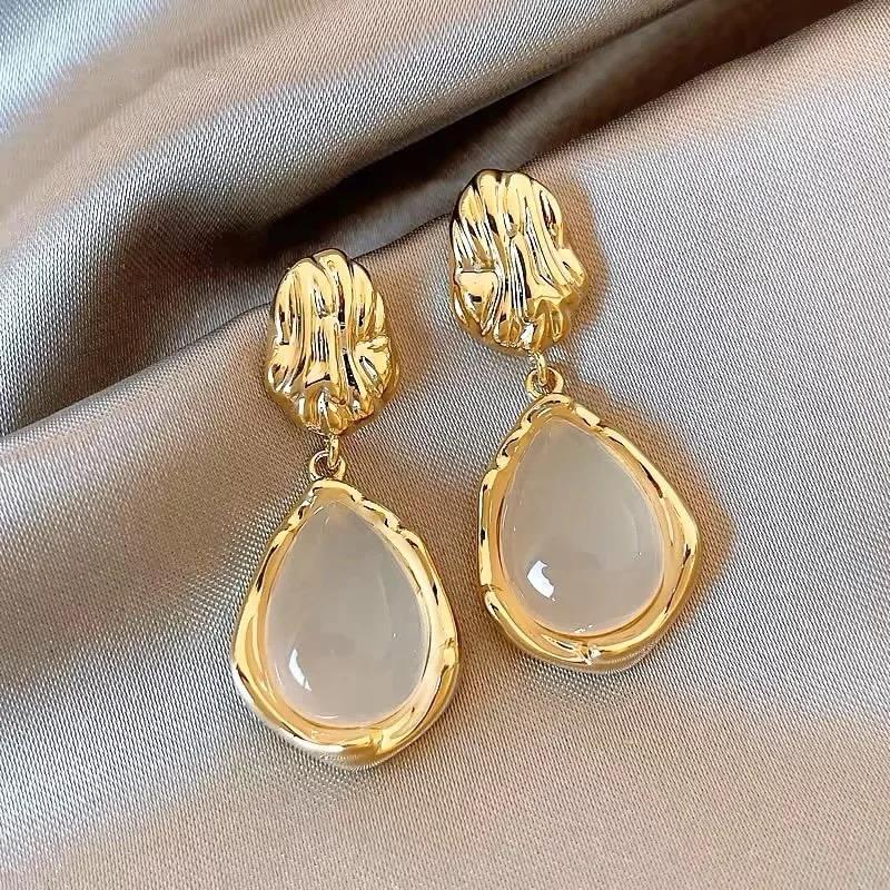 Gold pearl drop shape drop earrings