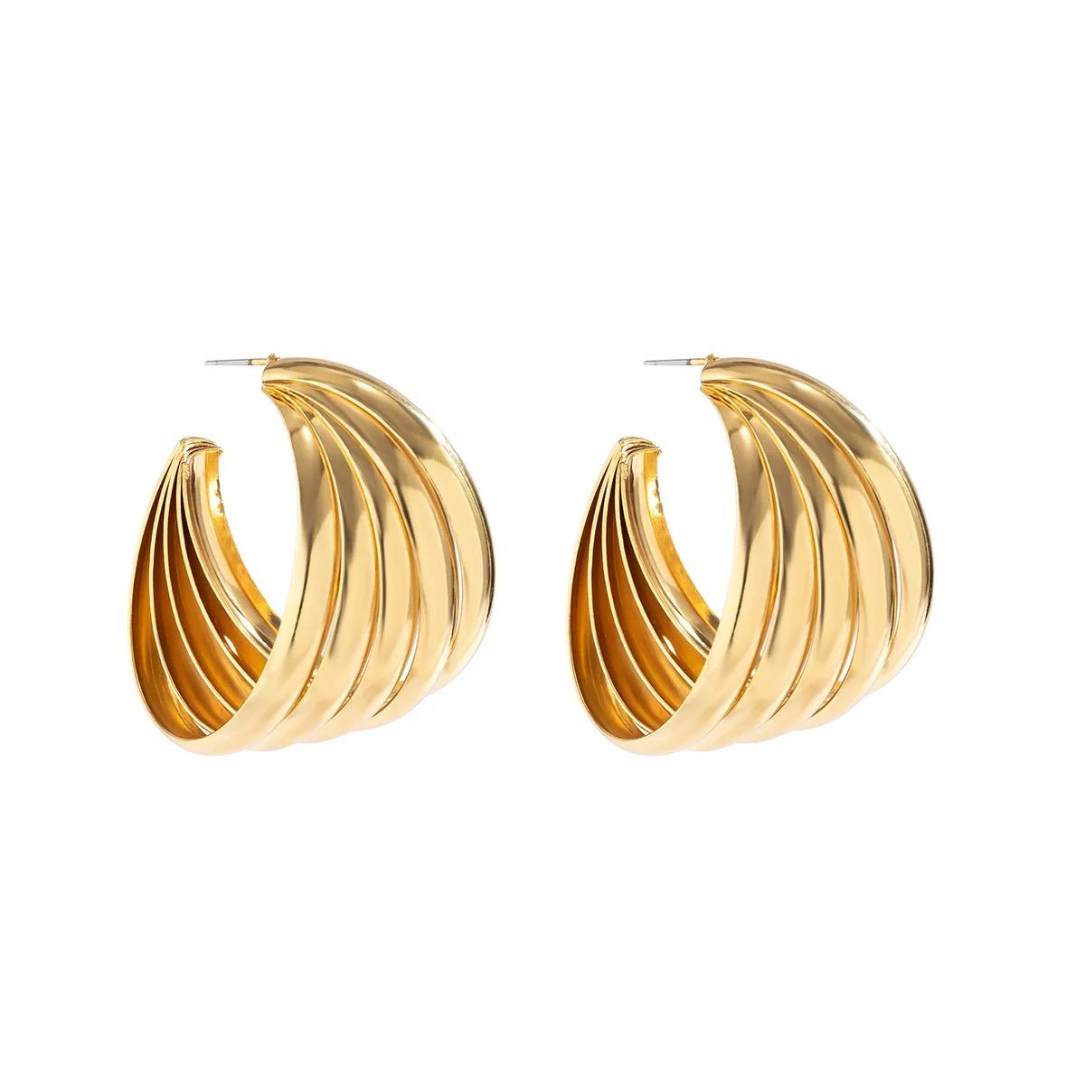 Gold wavy shell drop earrings